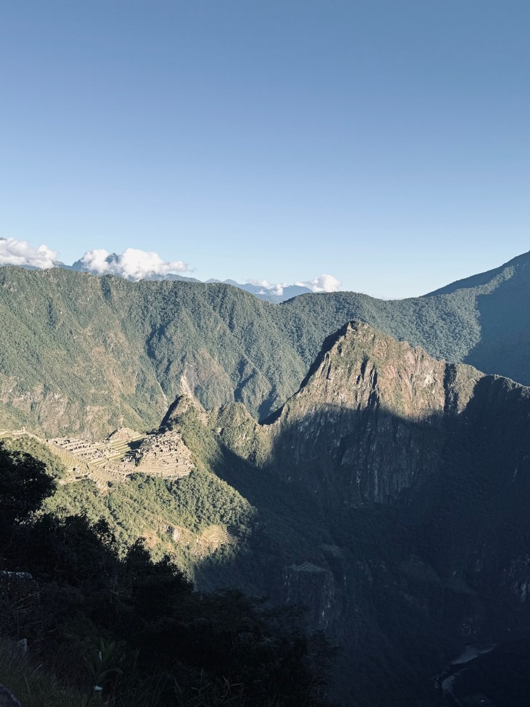 View of Machu Picchu from the Sun Gate at sunrise on the Inca Trail in Peru
