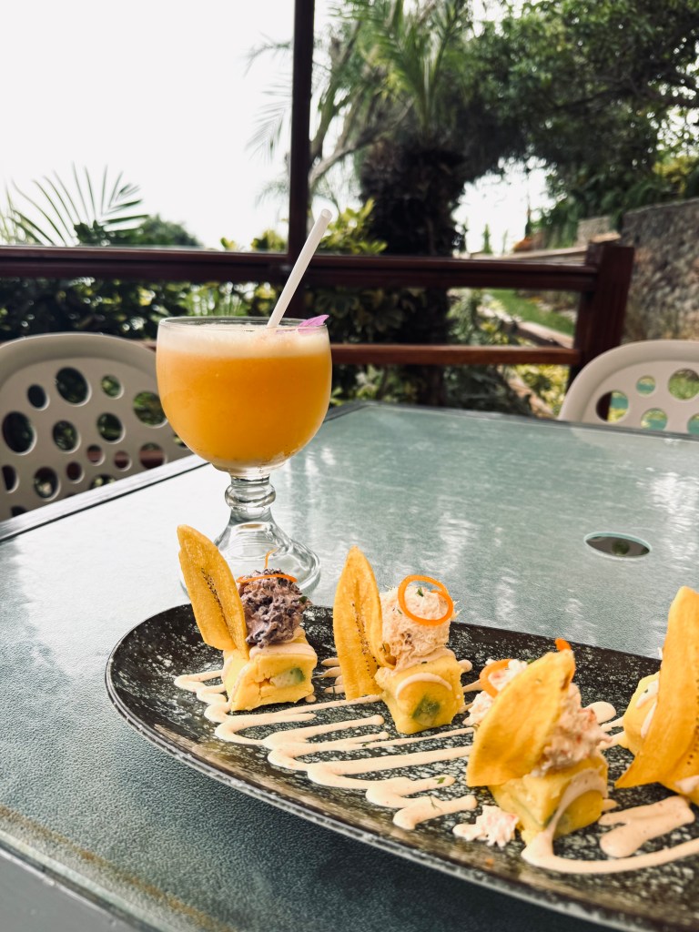 Pisco sour and causas dish on a table in a restaurant in Barranco, Lima, Peru