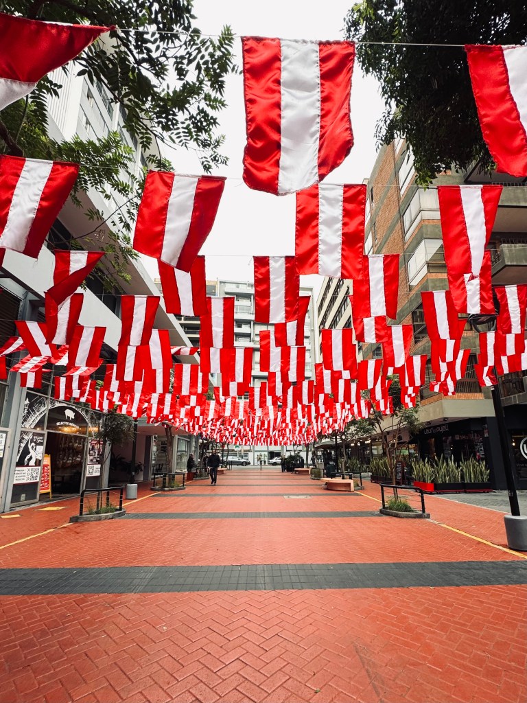 Red and White Peru flags on a street in Miraflores, Lima, Peru