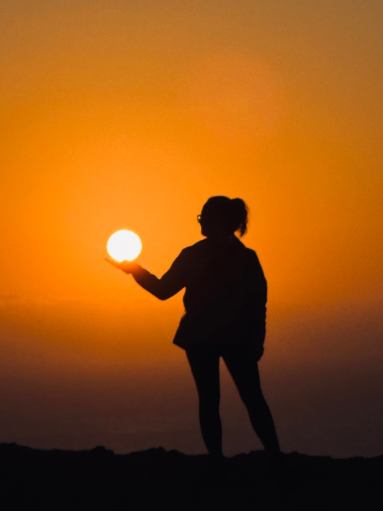 Golden Shadow with sun at sunset in Paracas National Reserve, Peru