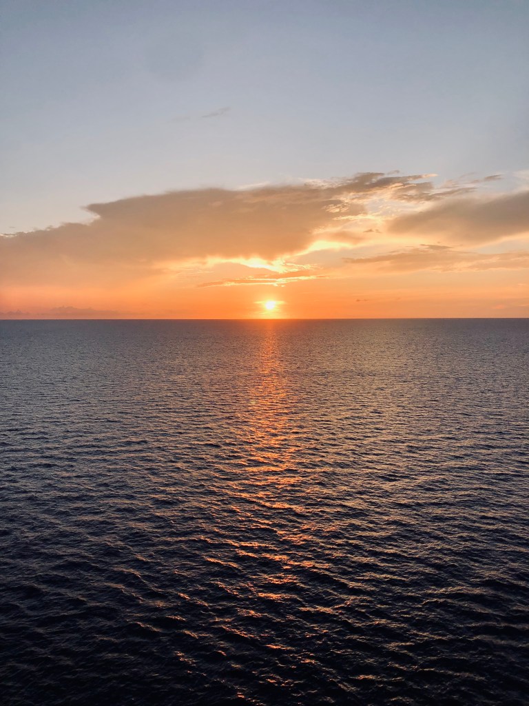 Sunset over the ocean onboard a disney cruise ship