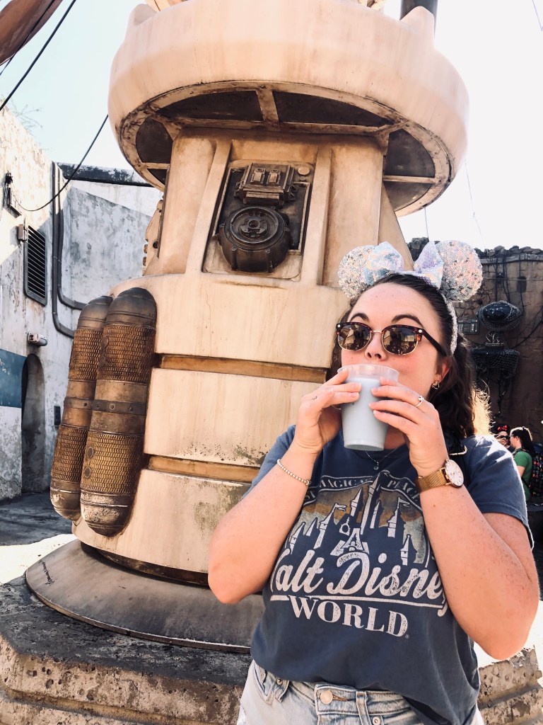 Girl drinking blue milk at galaxy's edge at hollywood studios in Florida