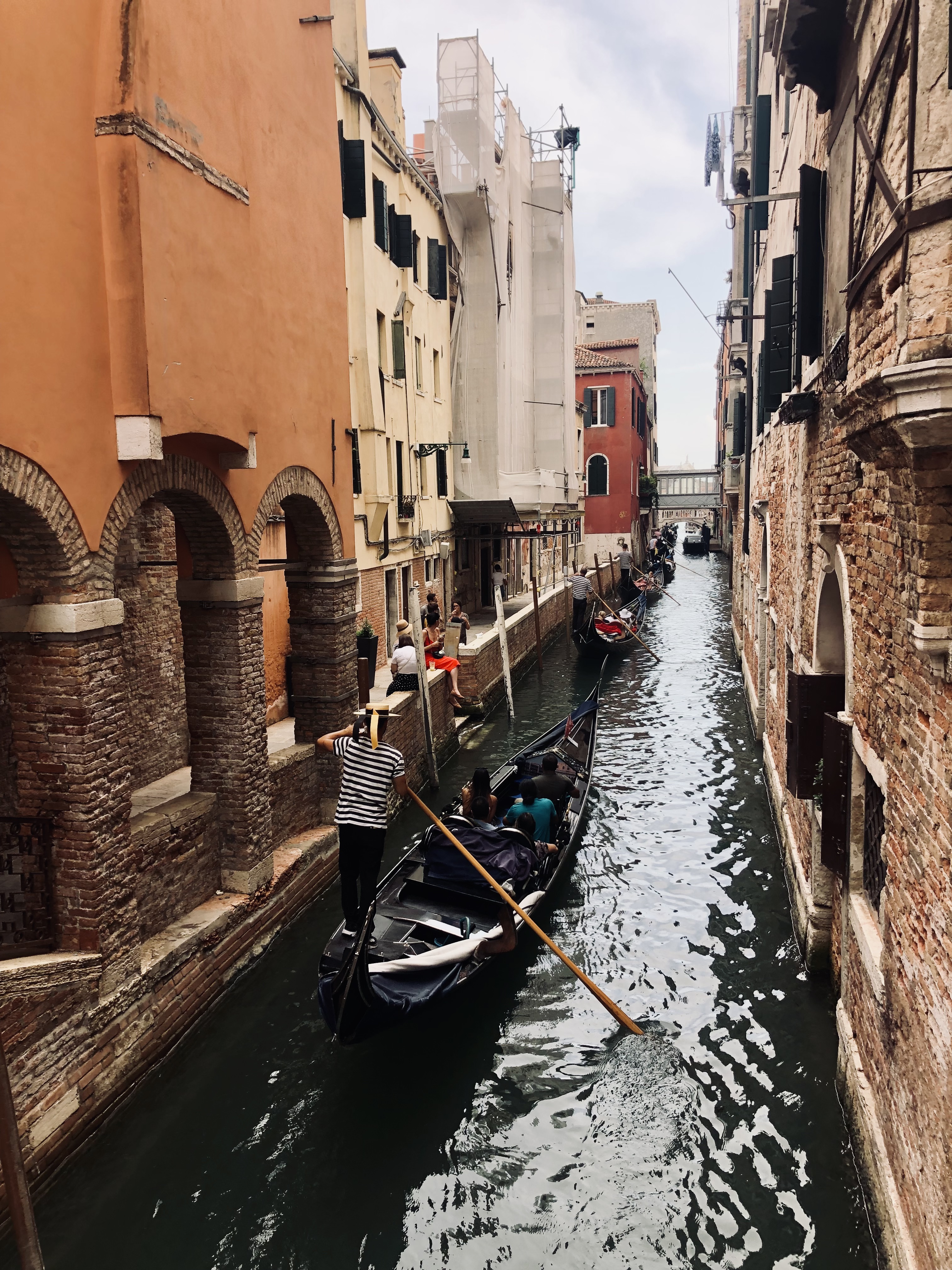 Gondolas floating through the canals and old buildings in Venice, Italy