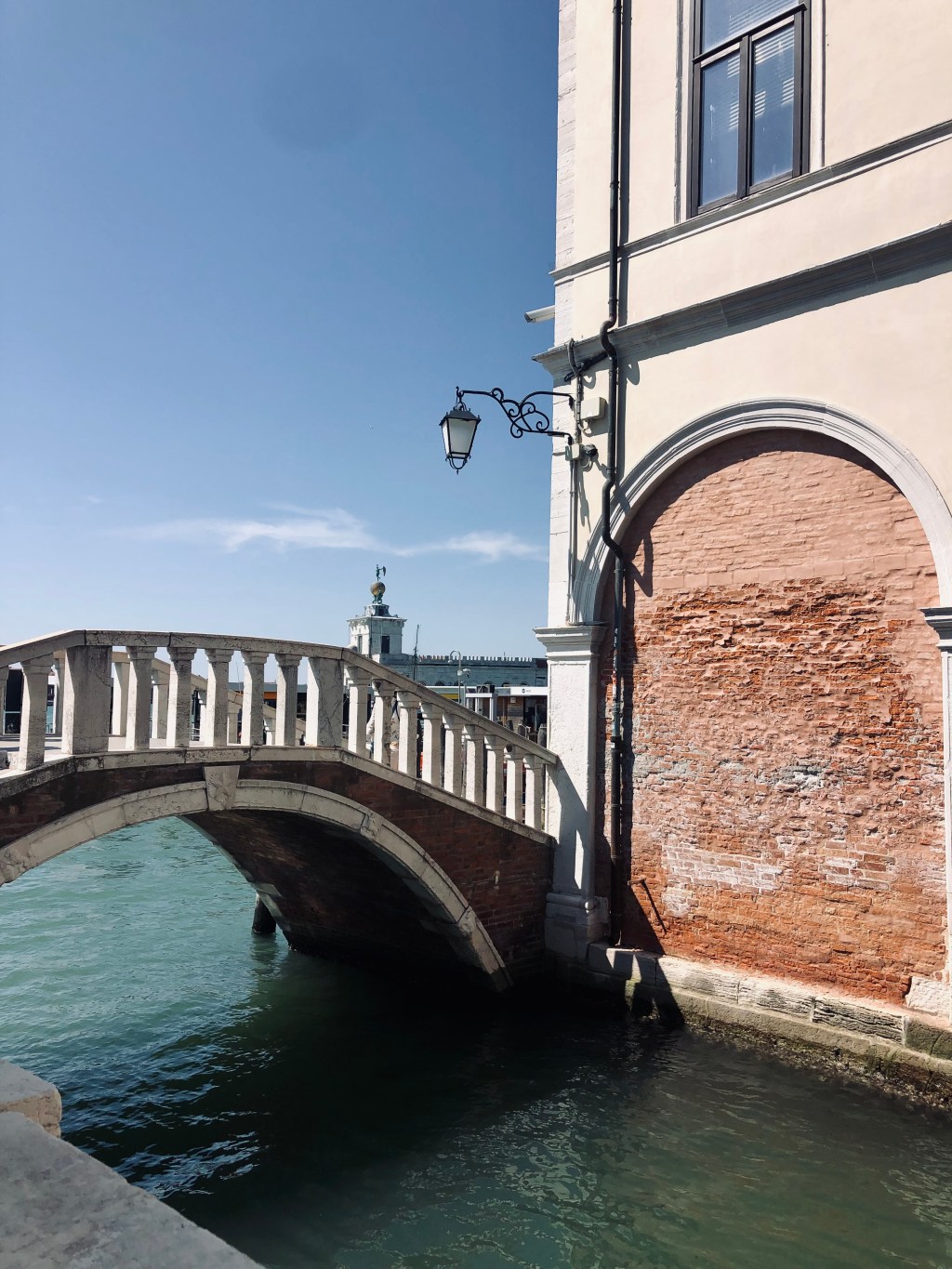 Beautiful little bridge over a canal in Venice, Italy