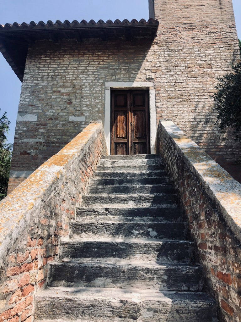 Old stone building with stairs on Torcello Island in Venice, Italy