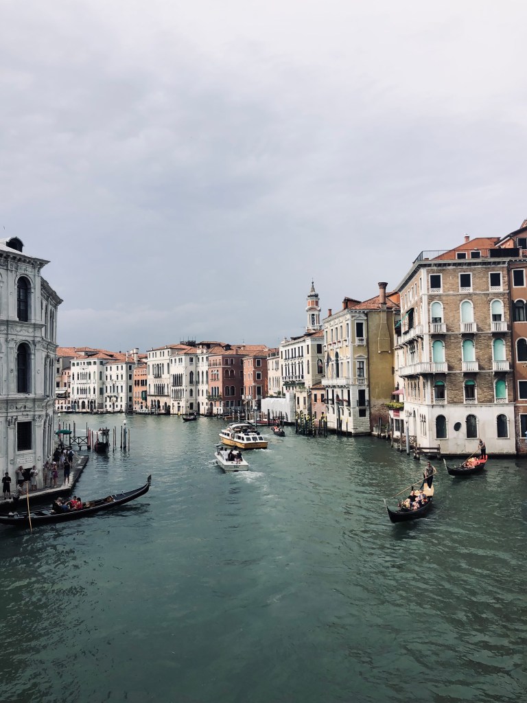 Beautiful old buildings and boats in the canal in Venice, Italy