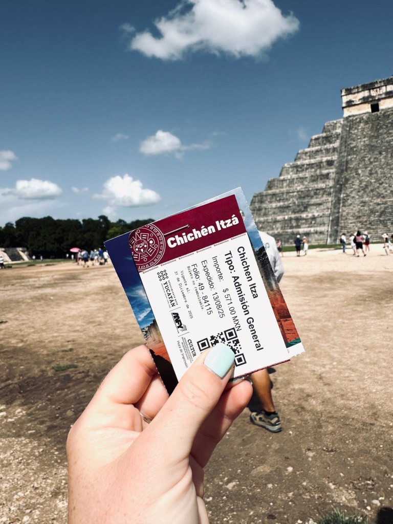 Hand holding tickets at Chichen Itza, Mexico