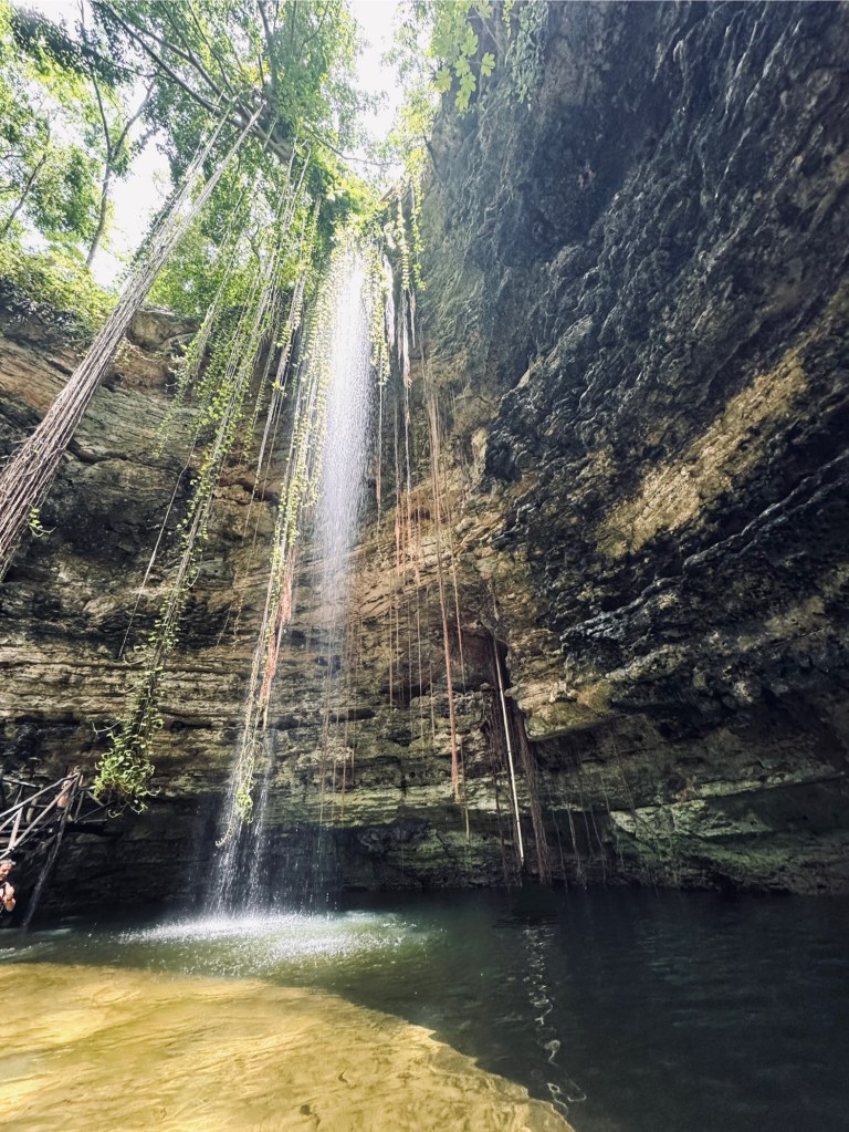 Waterfall at Chichikan Cenote sinkhole in Mexico