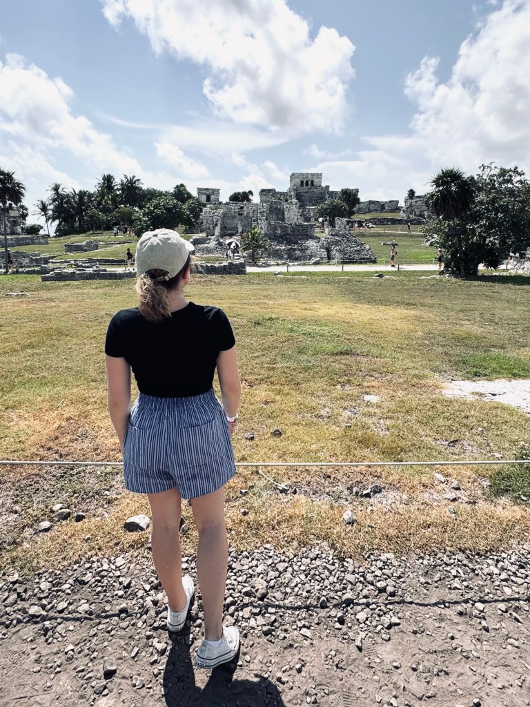 Girl looking out at Tulum Ruins, Mexico