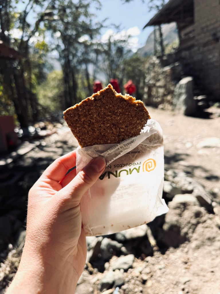 Hand holding health bar snack on the Inca Trail, Peru