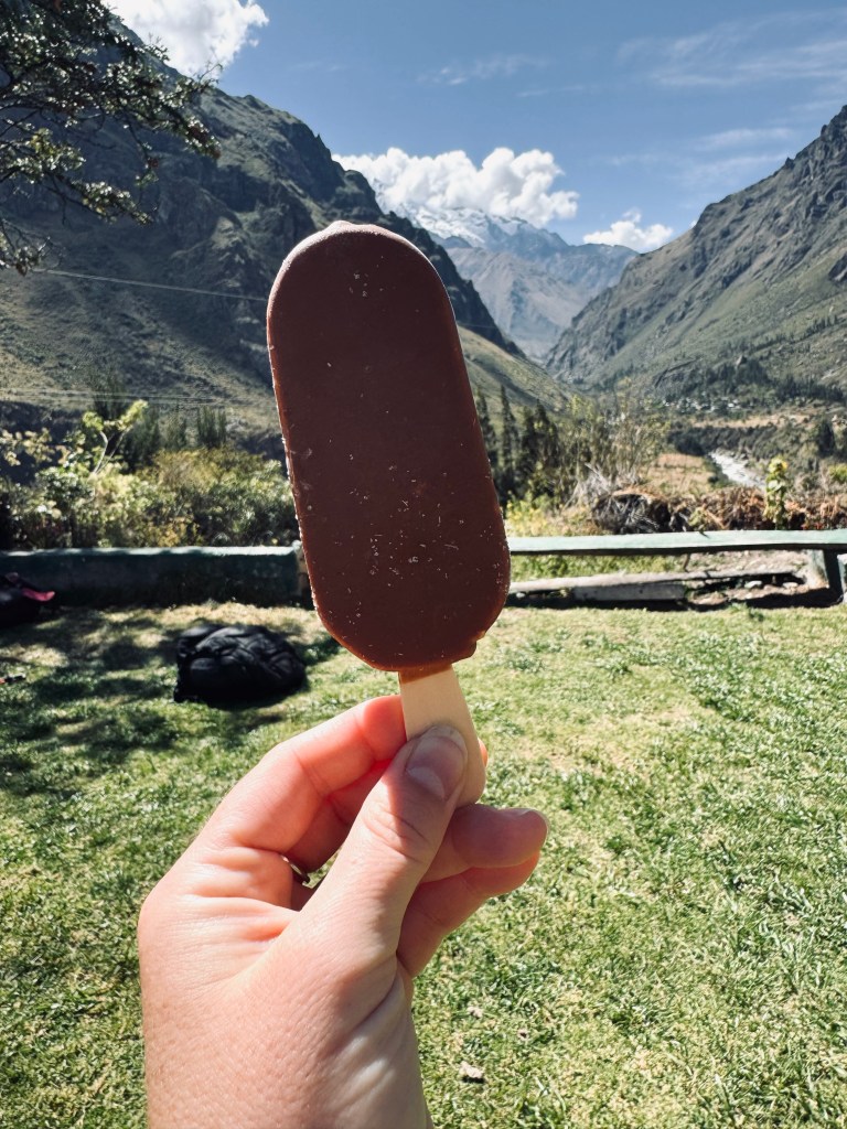 Hand holding ice cream bar on the Inca Trail, Peru