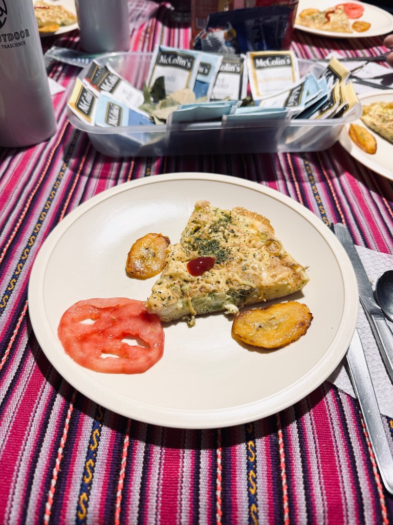 Plate with omelette and tomato for breakfast on the Inca Trail, Peru