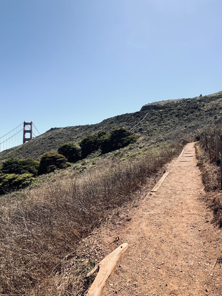 Hiking path up to viewpoint of Golden Gate Bridge on a sunny clear day in San Fransisco, USA