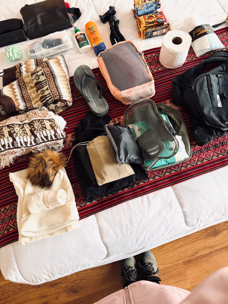 Neatly laid out packing cubes preparing for the Inca Trail in Peru