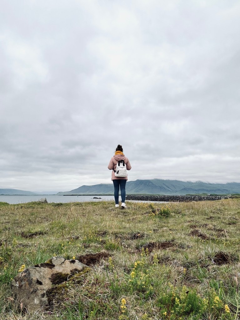 Girl looking out at mountains in Reykjavik, Iceland