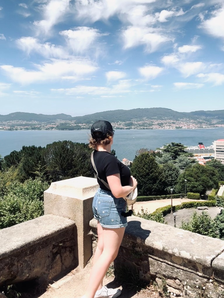 Girl looking out at ocean view in Vigo, Spain
