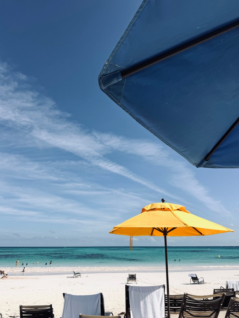 Beach with umbrellas at Lookout Cay at Lighthouse Point on a Disney Cruise in the Bahamas
