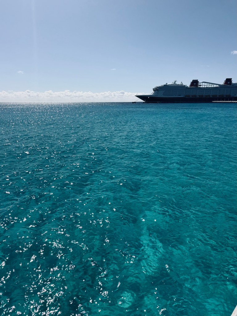 Crystal clear water with disney ship at Lookout Cay at Lighthouse Point on a Disney Cruise in the Bahamas