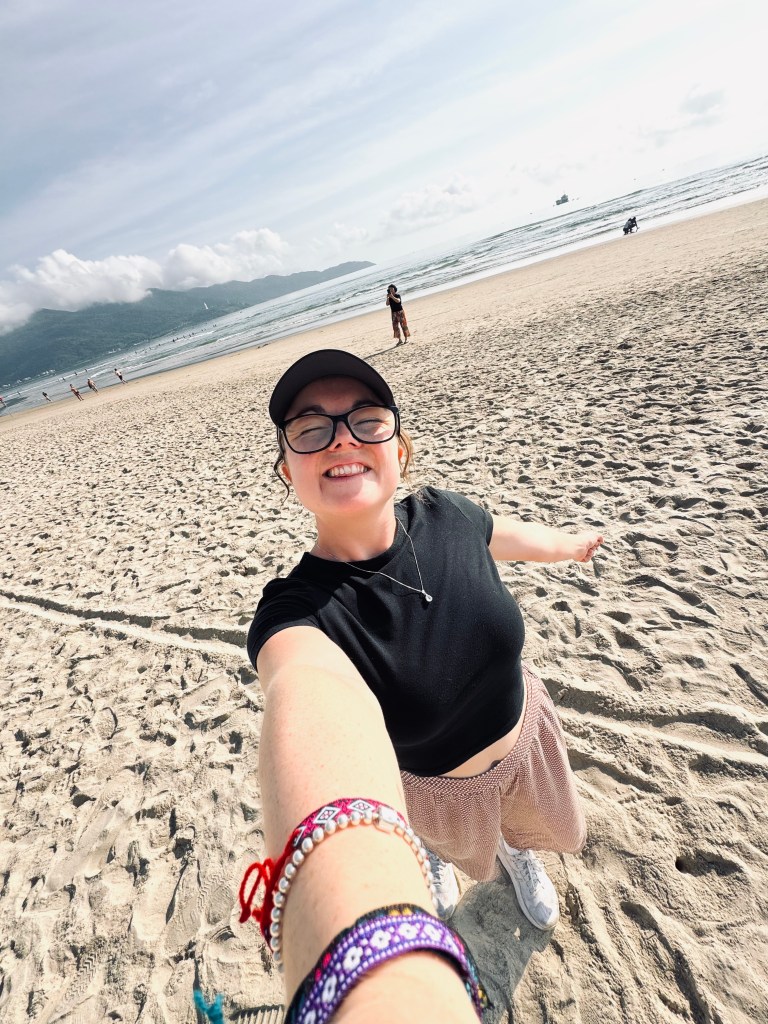 Girl taking selfie on the beach at Da Nang, Vietnam