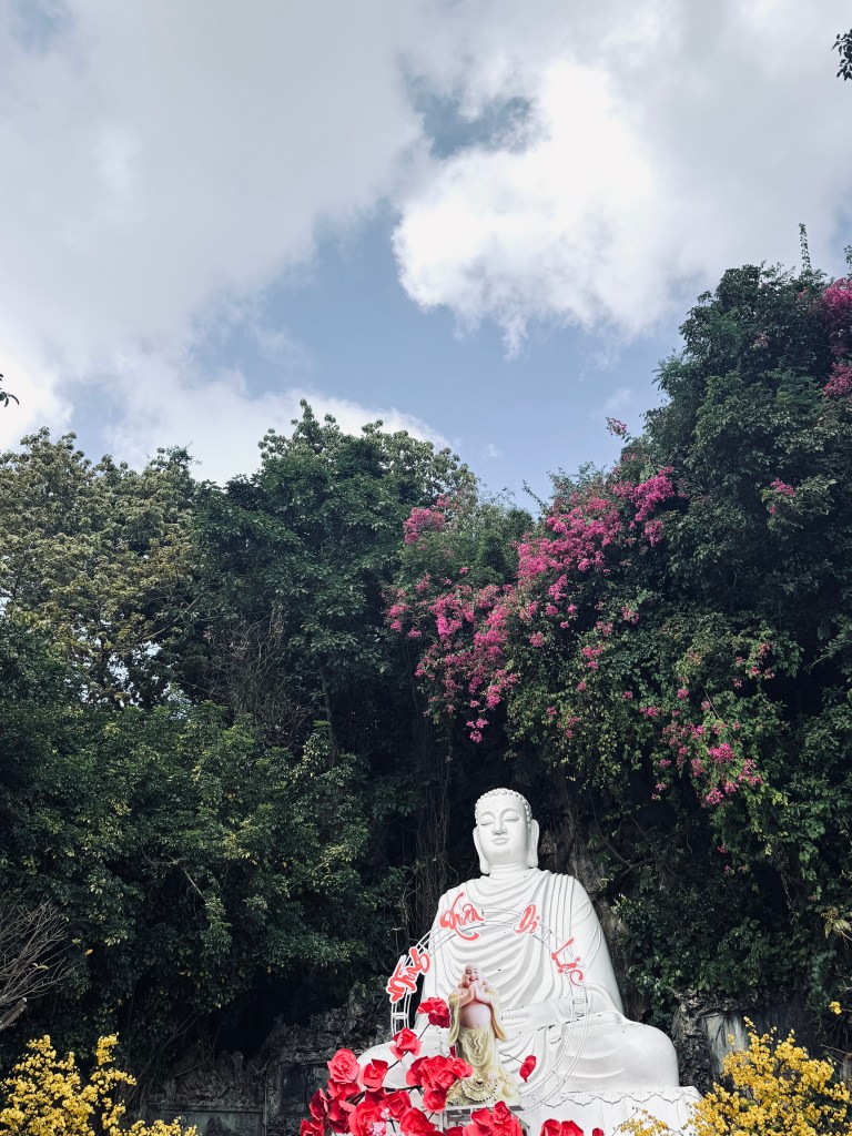 White Buddha in a garden at Marble Mountain in Da Nang, Vietnam