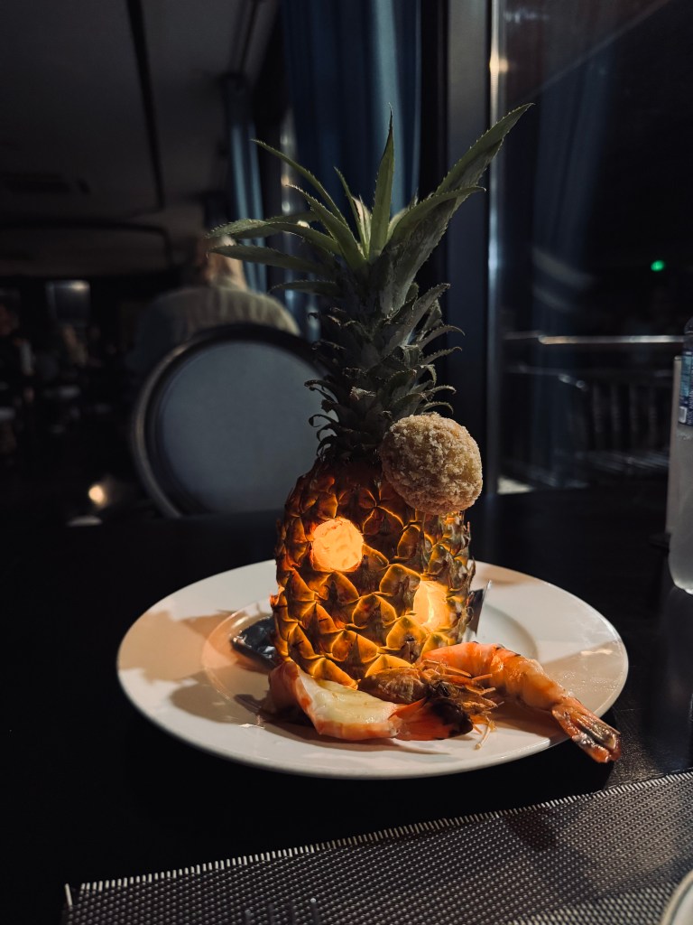 Pineapple with king prawn dinner on a Halong Bay cruise, Vietnam