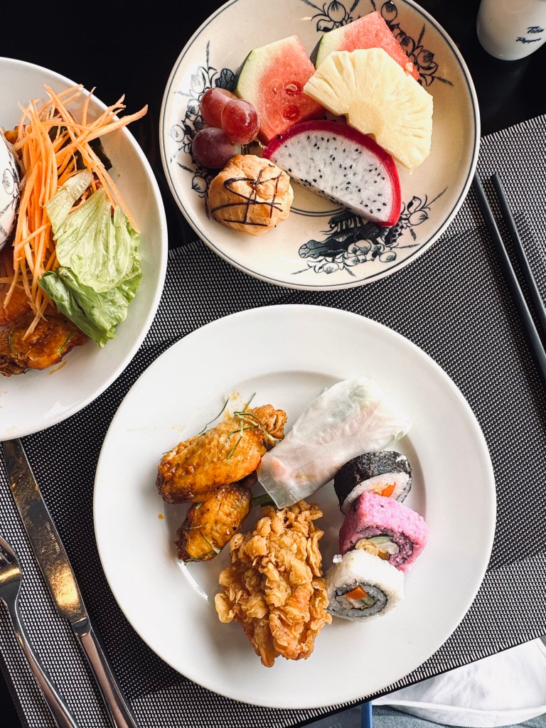 Buffet lunch with sushi and Vietnamese rolls on a Halong Bay cruise, Vietnam