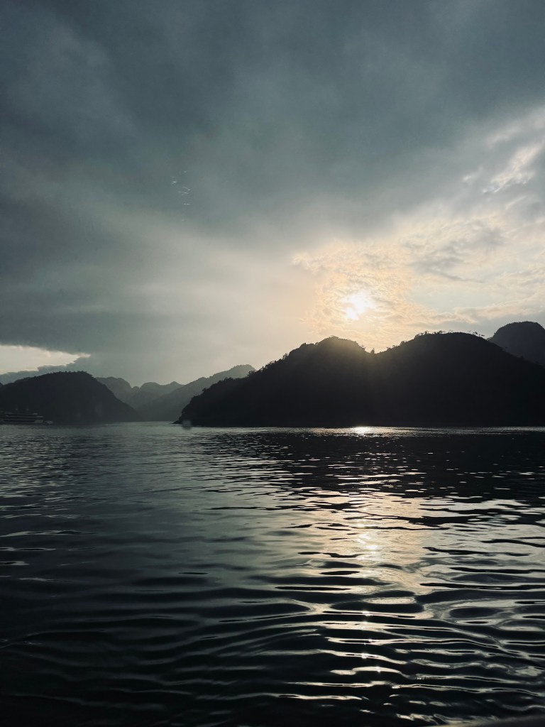 Sunset over limestone islands on a Halong Bay cruise, Vietnam