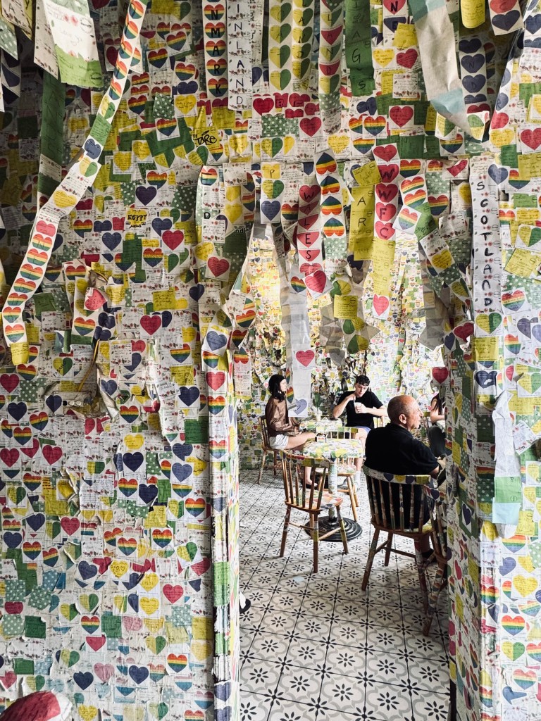 Cafe covered in sticky notes at The Note Cafe in Hanoi, Vietnam