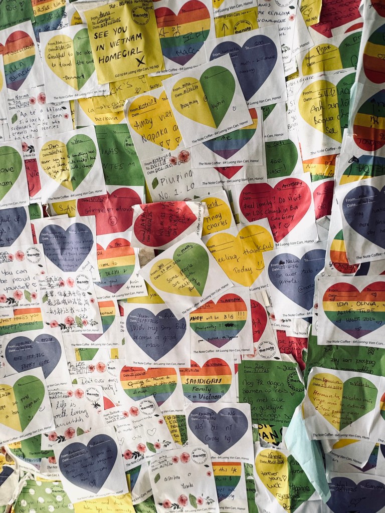 Wall covered in sticky notes at The Note Cafe in Hanoi, Vietnam