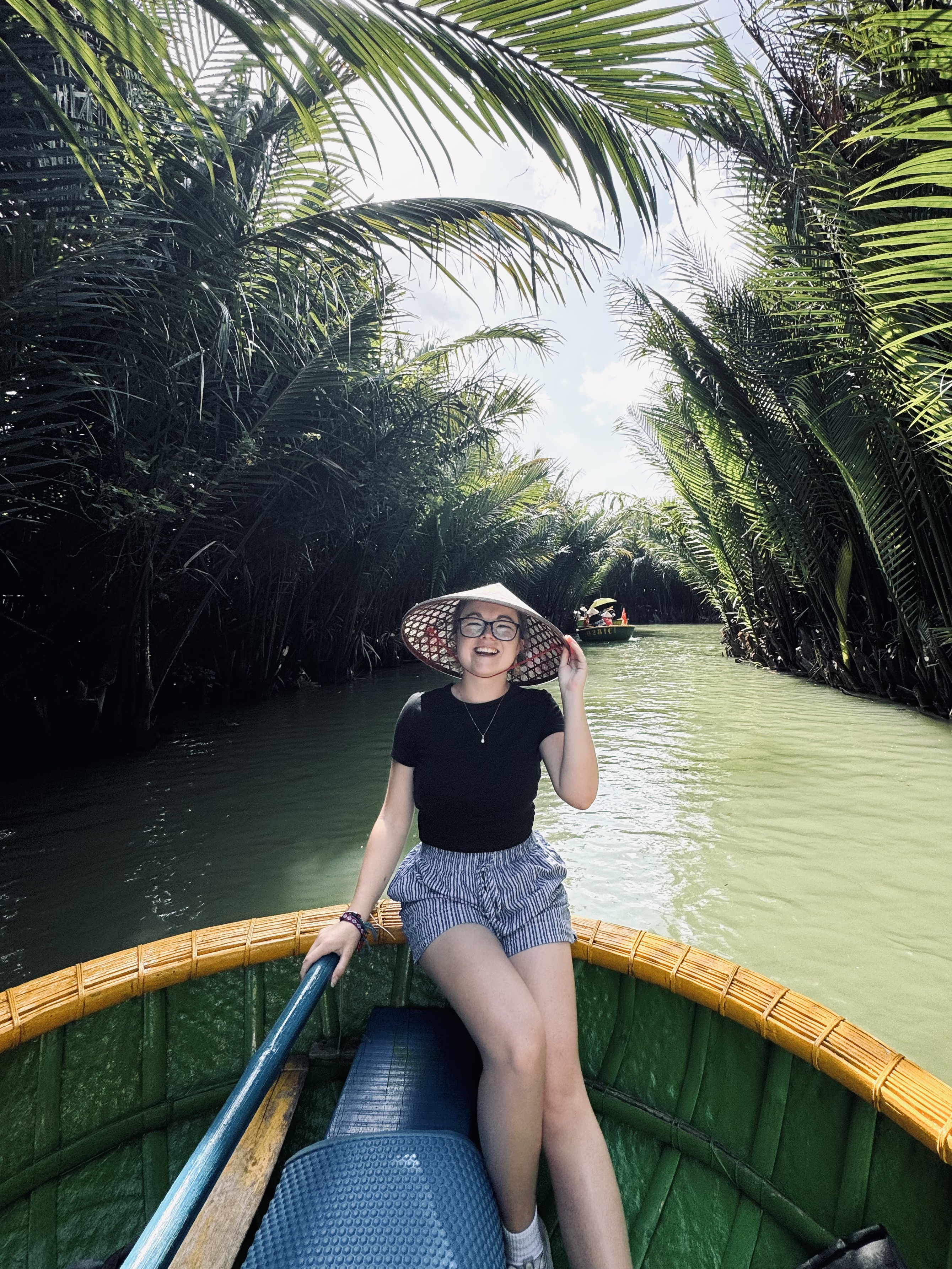 Girl on a coconut boat in Ancient Town of Hoi An, Vietnam