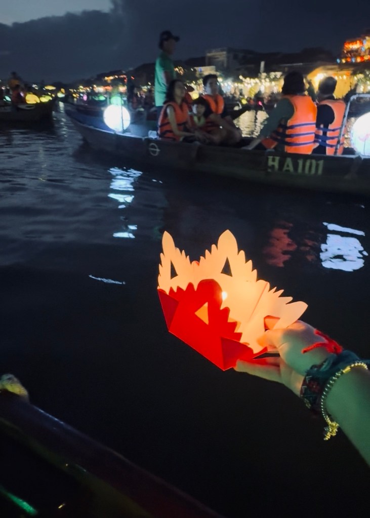 Holding a paper lantern in Ancient Town of Hoi An, Vietnam
