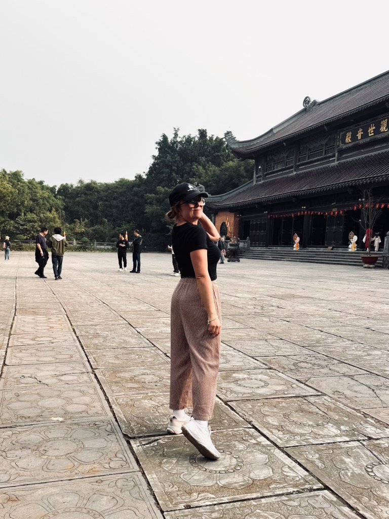 Girl posing in front of pagoda at Bai Dinh in Ninh Binh, Vietnam