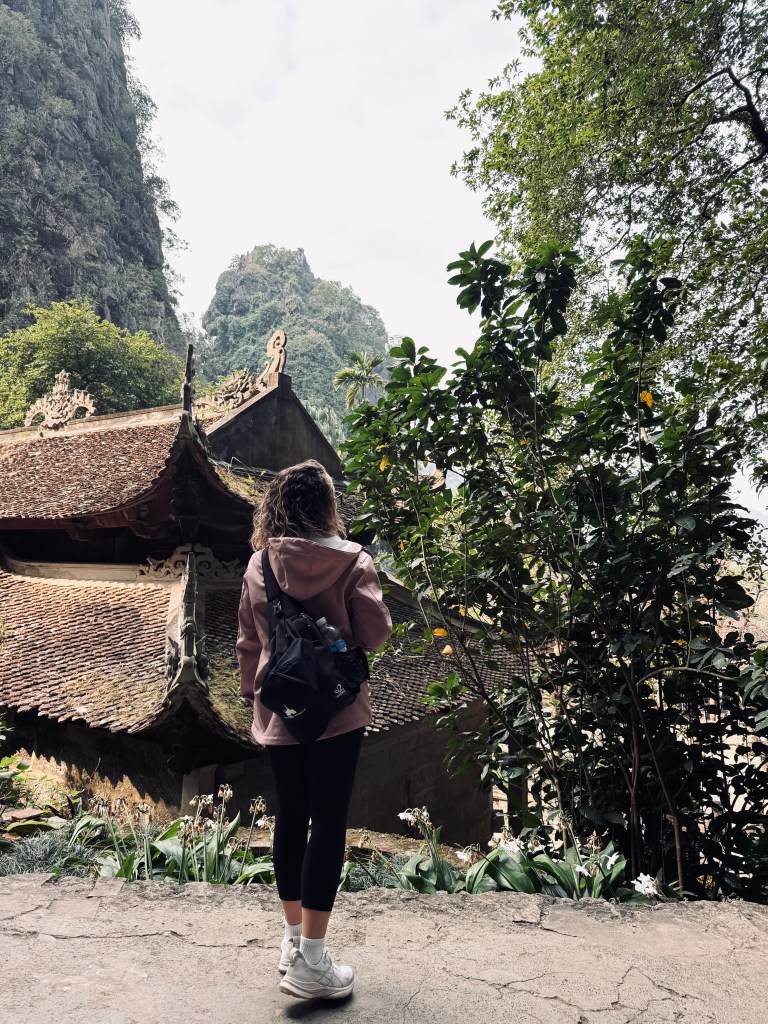 Girl looking out at Bich Dong pagoda in Ninh Binh, Vietnam