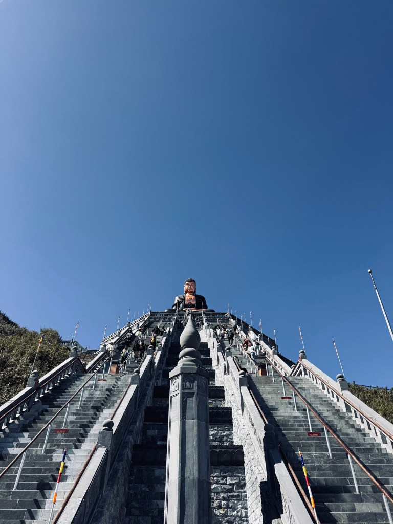 Big Buddha at the top of a big staircase at the top of Fansipan Mountain in Sapa, Vietnam