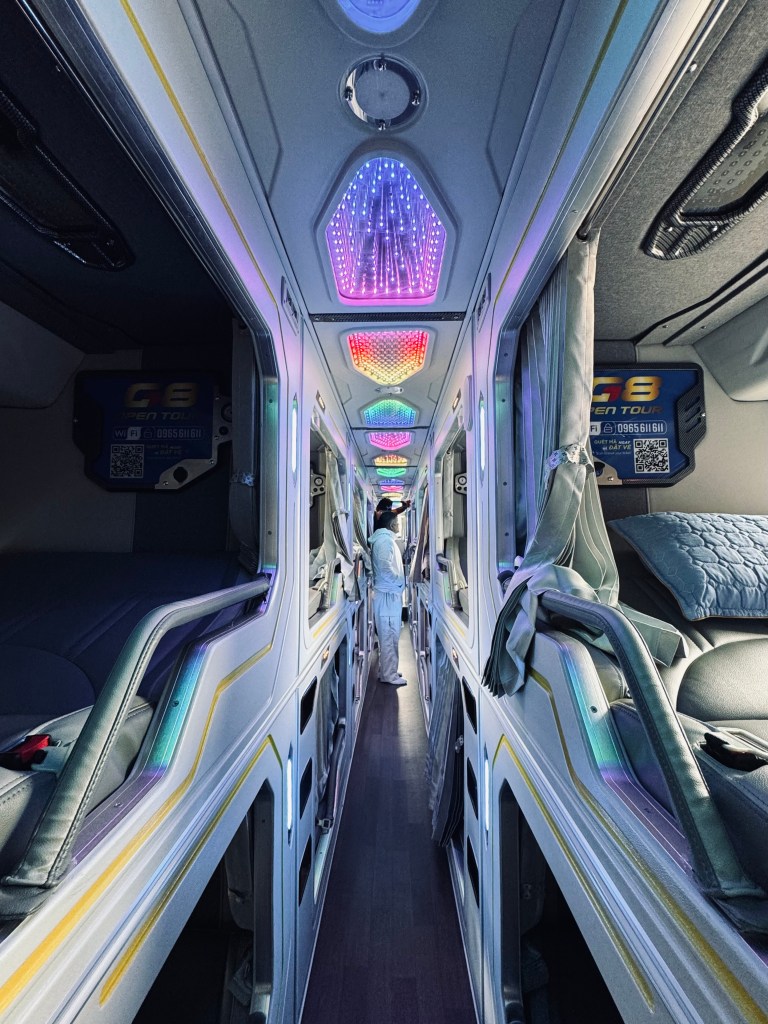 VIP Sleeper bus aisle with bunk bed pods in Vietnam